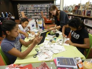 Teens at a craft table at the Ramsey County Library, Maplewood, MN.