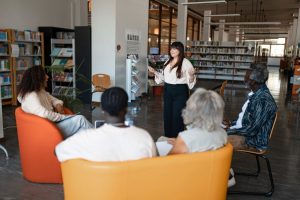 Group of adults meeting at a library. 