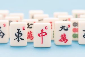 Mahjong tiles are pictured standing. 