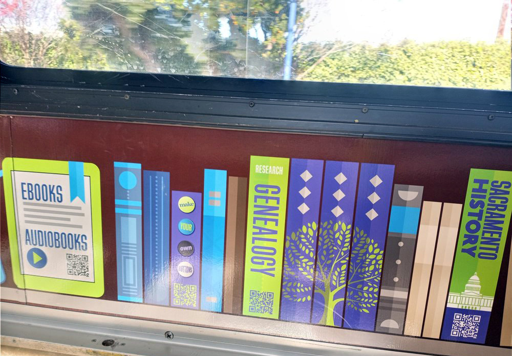 Various online resources available through the Sacramento Public Library system are QR code-accessible via wallpapering on the Sacramento Rolling Library Train. (Photo Courtesy of Yelp/Used for Educational Purposes)
