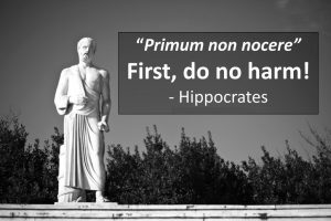 Statue of Hippocrates with the caption "Primum non nocere" or "First, Do no Harm"