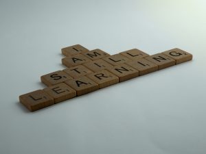 Scrabble tiles arranged to say "I am still learning"