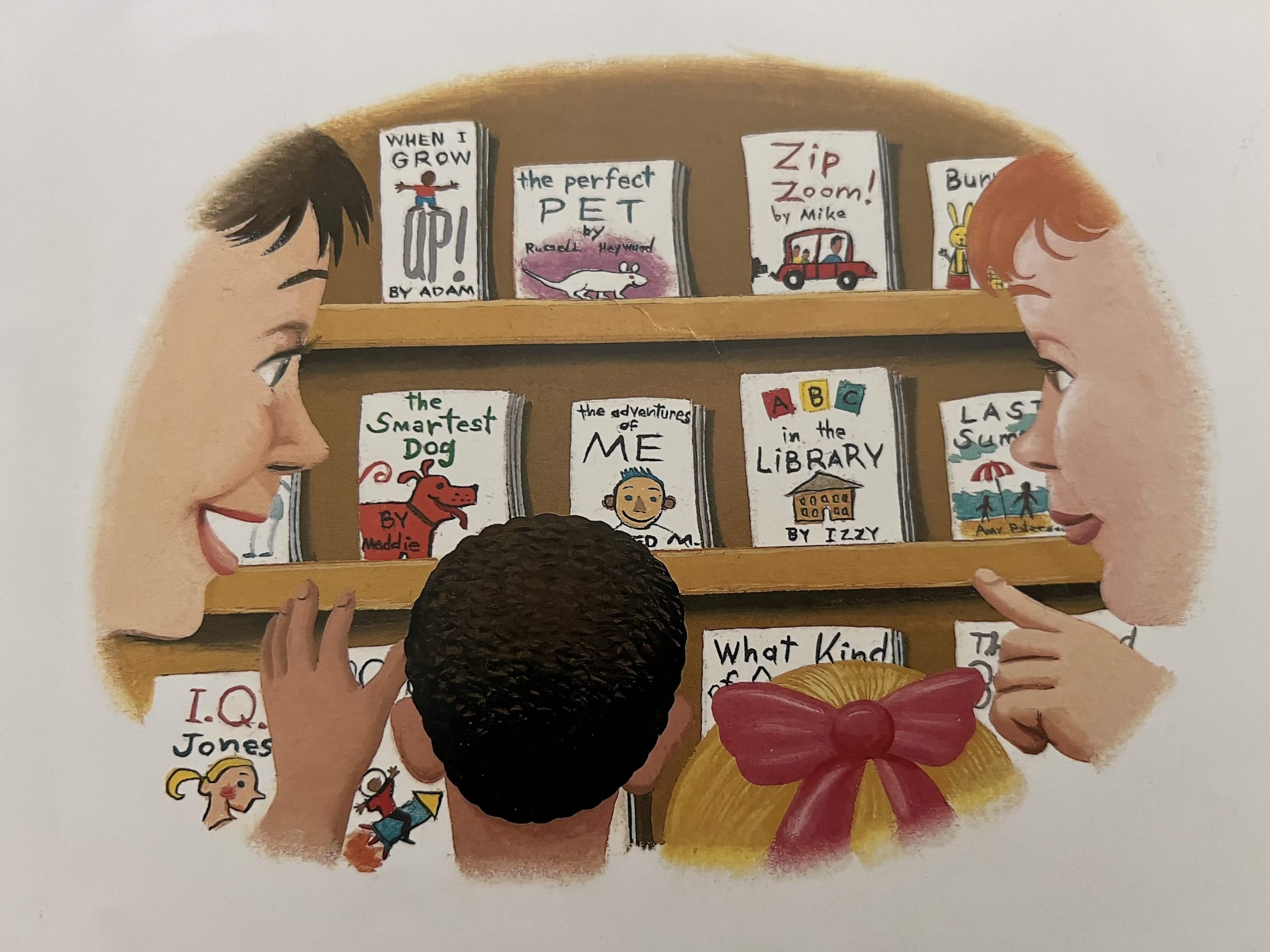 People look at a wall of home made books.