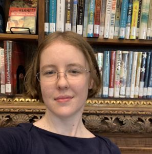 Photo of myself against bookshelves